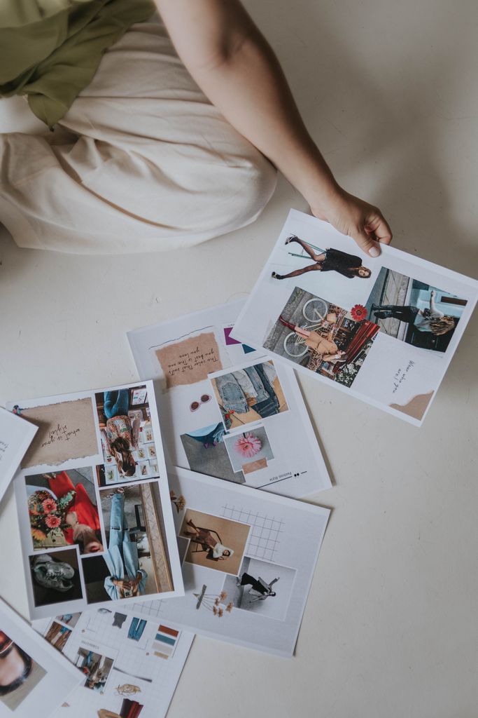 Artistic collection of photos and collages creatively arranged on the floor.